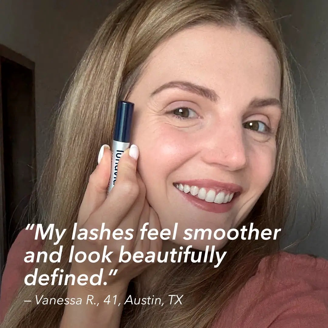 Woman holding eyelash serum with review about smoother, defined lashes