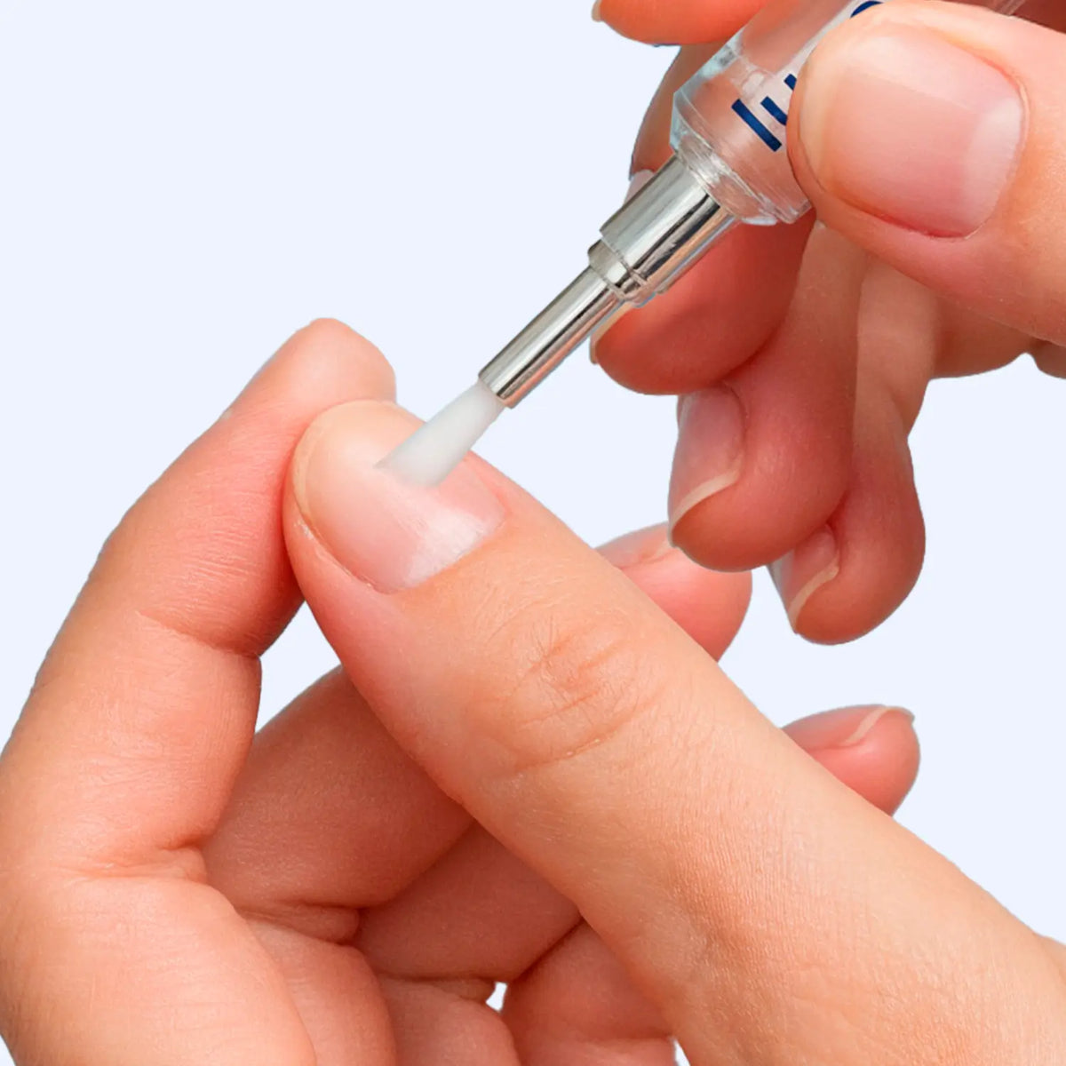 Close-up of Lunavia™ Nail Strengthening Pen being applied to fingernail