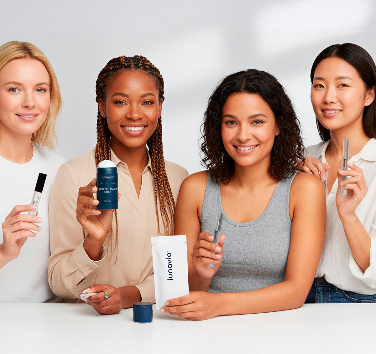 A group of women holding Lunavia skincare products